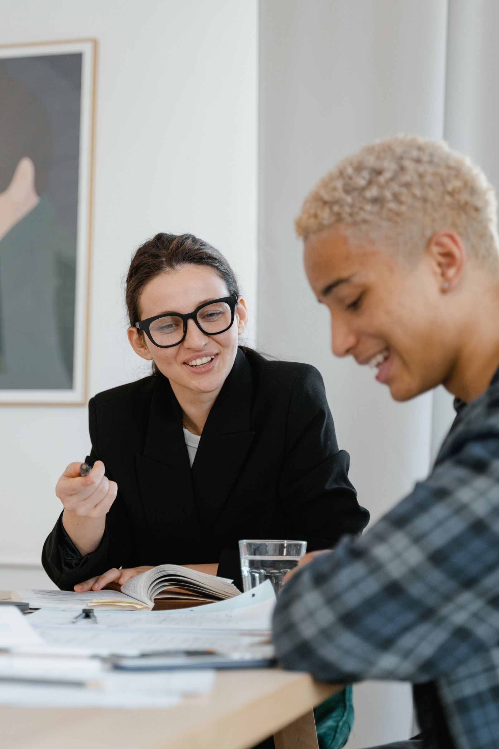 An adult supporting a young person with a learning activity